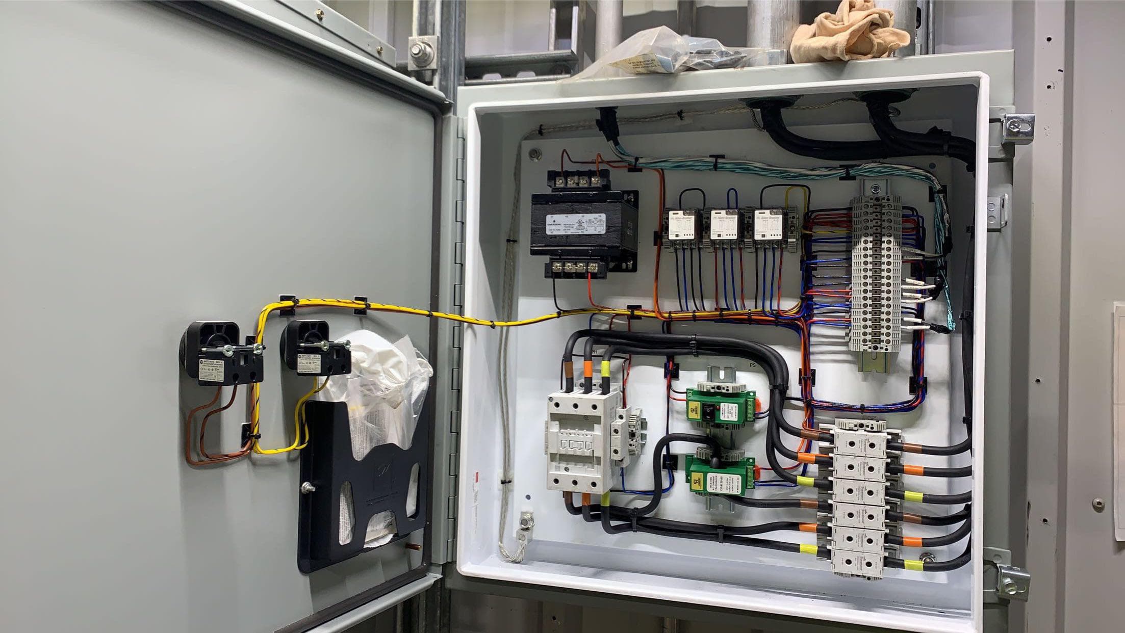 Photo showing a neatly routed harness installed in an industrial panel