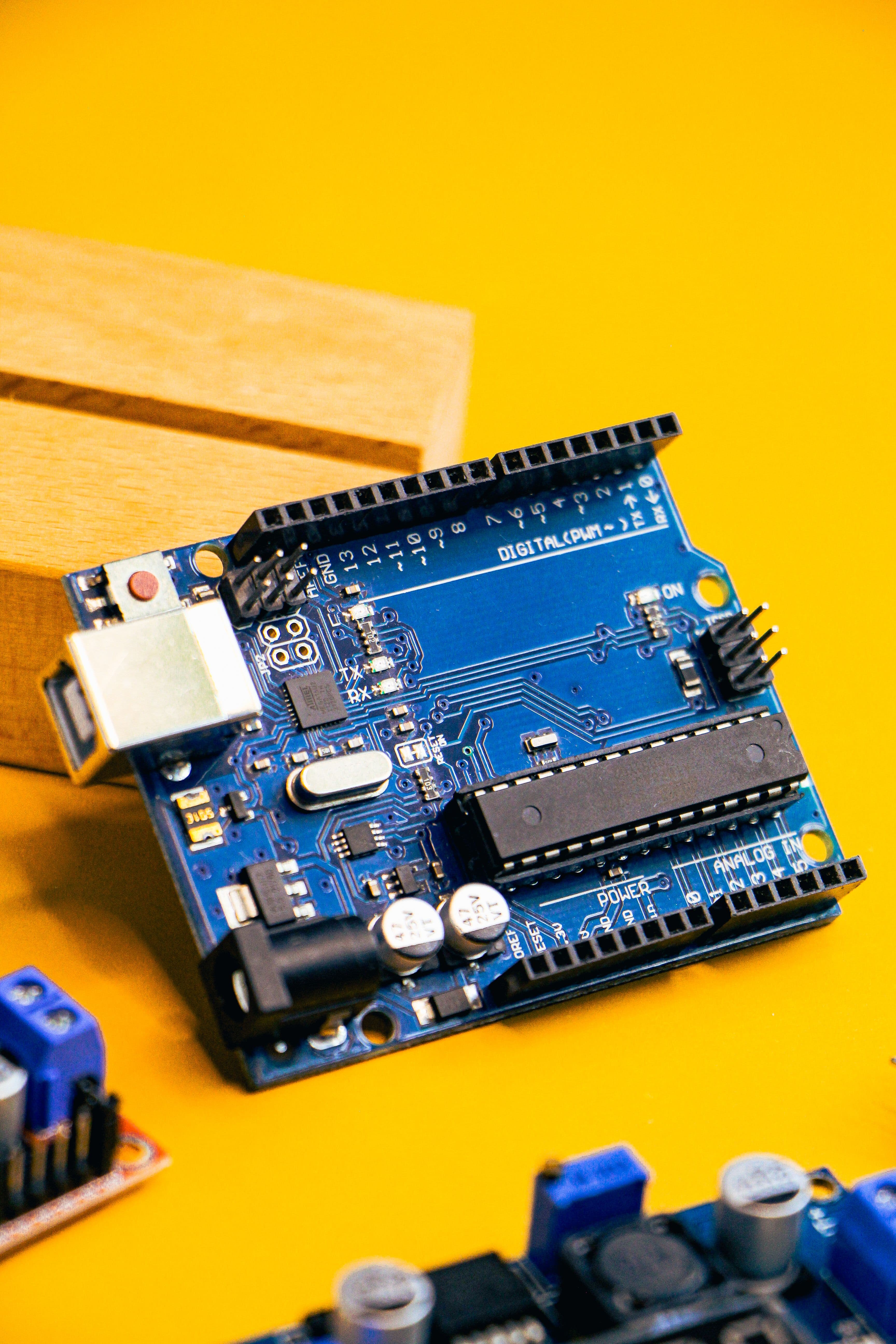 Engineers collaborating on schematic and PCB layout, with thermal and signal simulations on-screen